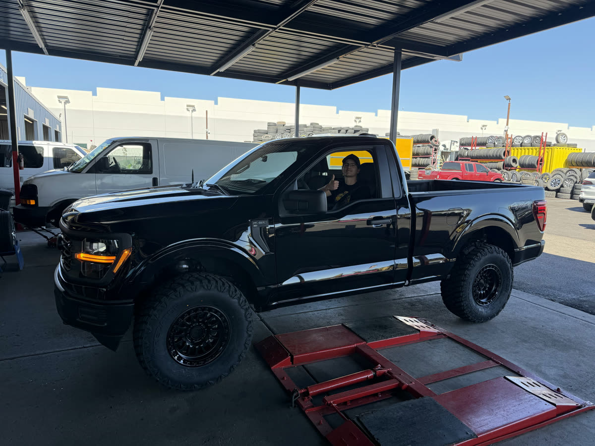 Truck on lift in Wheel Master service bay